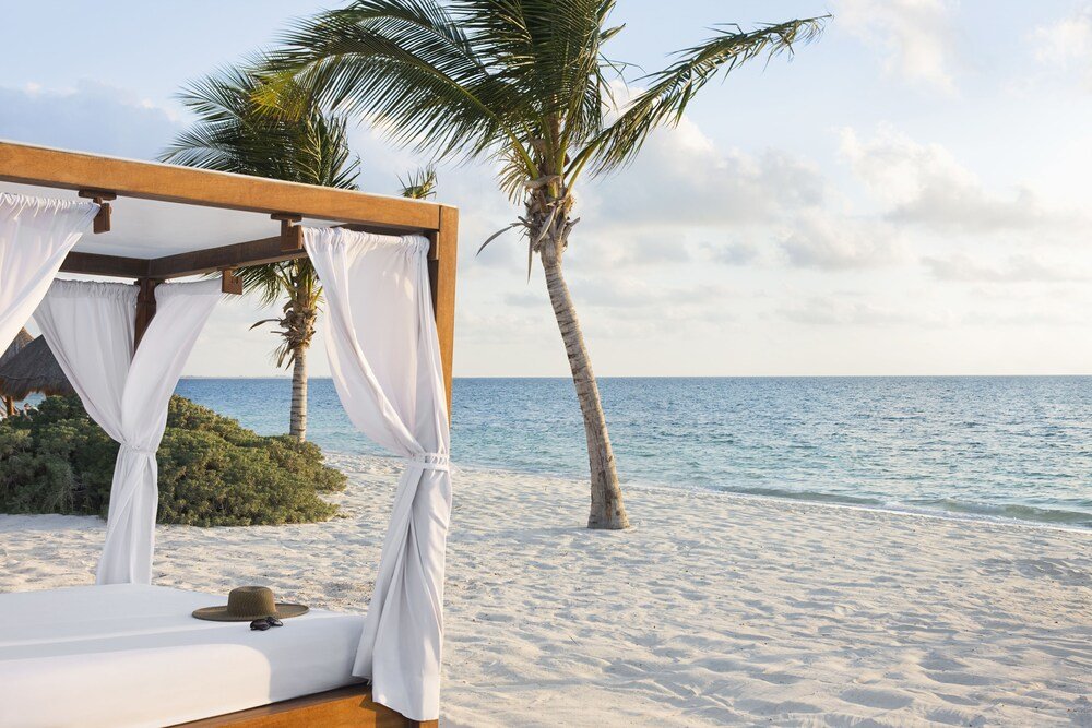 Private beach with loungers at Excellence Playa Mujeres