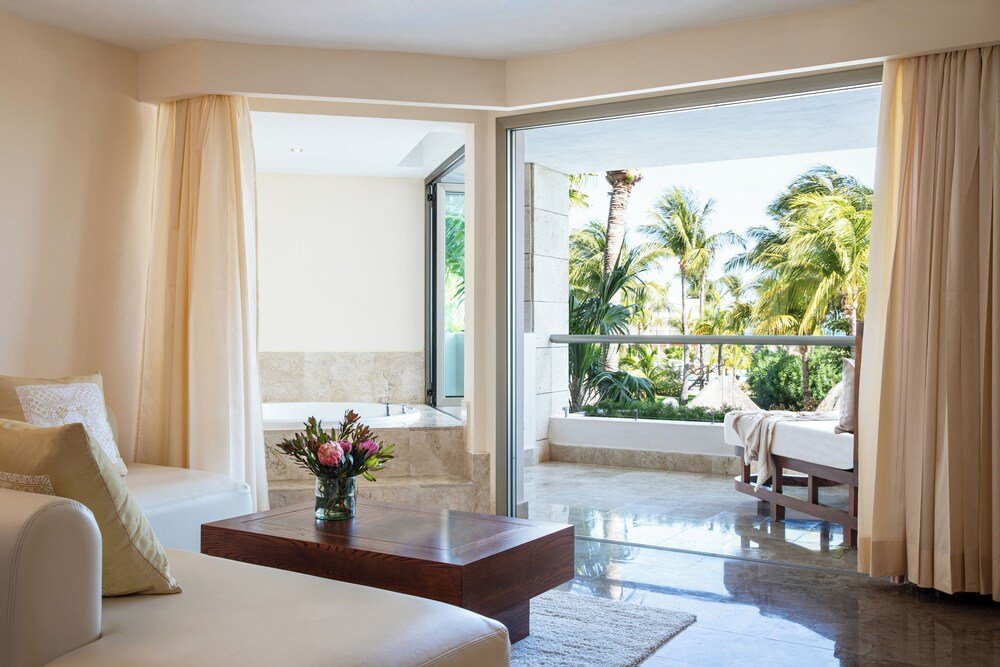 Evening view of Excellence Playa Mujeres resort grounds